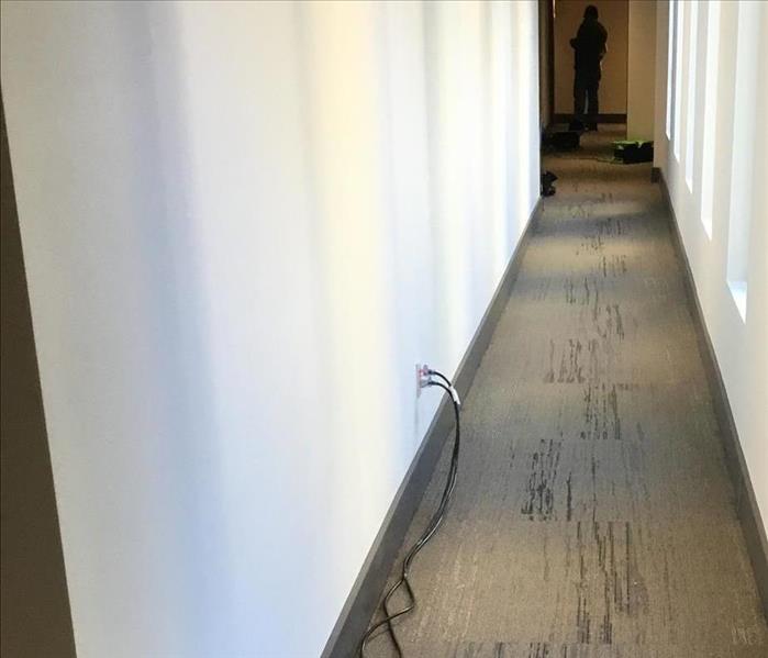 By the time the After Photo was taken, SERVPRO professionals were able to restore carpeting while keeping baseboards intact. 