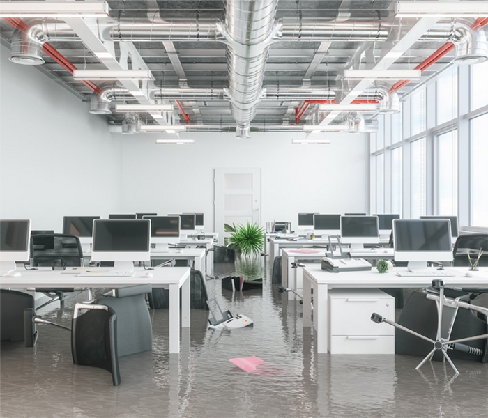 a flooded office with water covering the floor