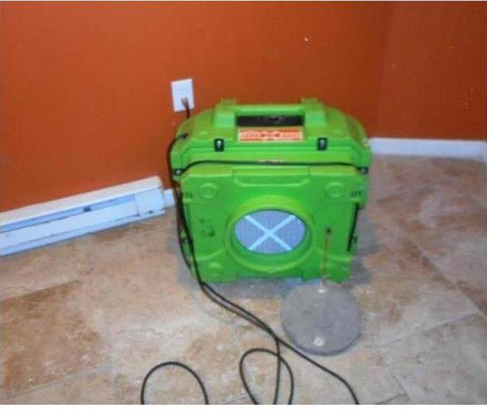 SERVPRO air mover being used in water damaged room